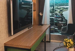 A staycation-ready condominium with a TV and a view of Aeon Tower Davao.