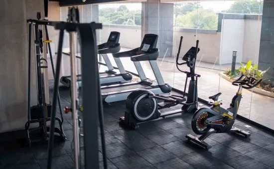 Hotel gym equipment in a room with a view.